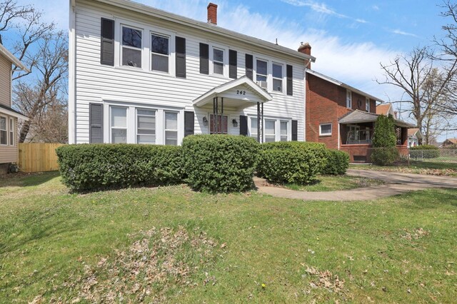 242 Davis Rd, Mansfield, OH 44907 - colonial inspired home featuring fence, a chimney, and a front yard