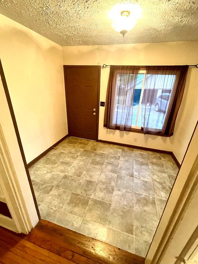 242 Davis Rd, Mansfield, OH 44907 - interior space with baseboards and a textured ceiling