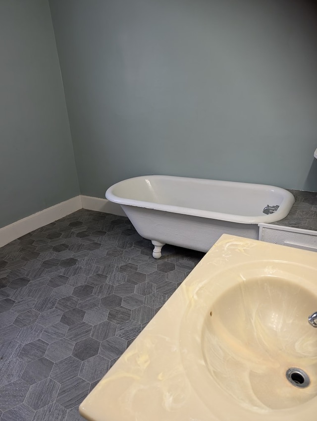 bathroom with a tub and sink