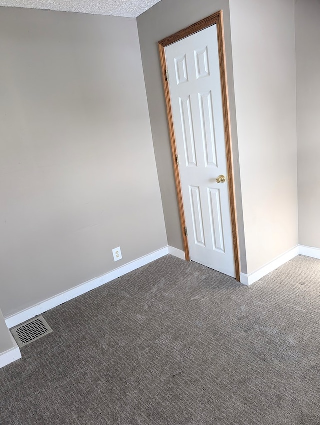 spare room with carpet