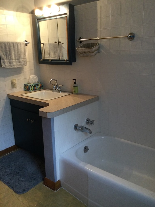 1009 Twp Rd Unit 2156, Ashland, OH 44805 - bathroom with a bath, vanity, tile walls, and tasteful backsplash