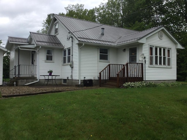 1009 Twp Rd Unit 2156, Ashland, OH 44805 - back of house with a yard and metal roof