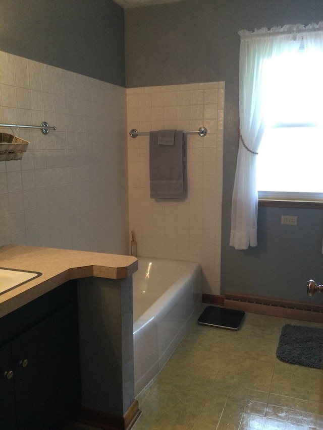 1009 Twp Rd Unit 2156, Ashland, OH 44805 - bathroom featuring vanity, a bathtub, and baseboard heating
