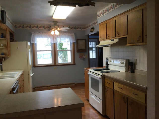 1009 Twp Rd Unit 2156, Ashland, OH 44805 - kitchen featuring white electric range, under cabinet range hood, baseboard heating, a sink, and ceiling fan