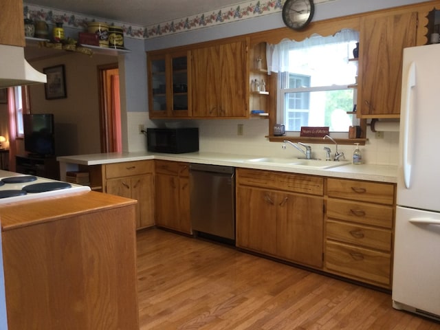 1009 Twp Rd Unit 2156, Ashland, OH 44805 - kitchen with dishwasher, freestanding refrigerator, black microwave, and brown cabinets