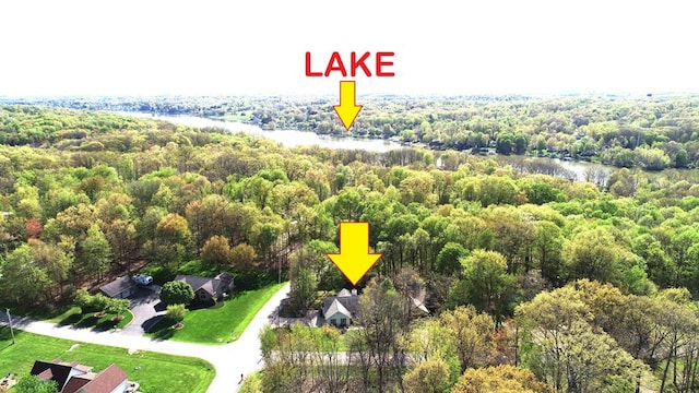aerial view with a water view and a forest view