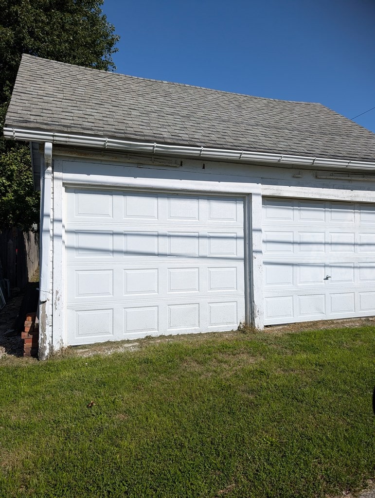 garage with a yard