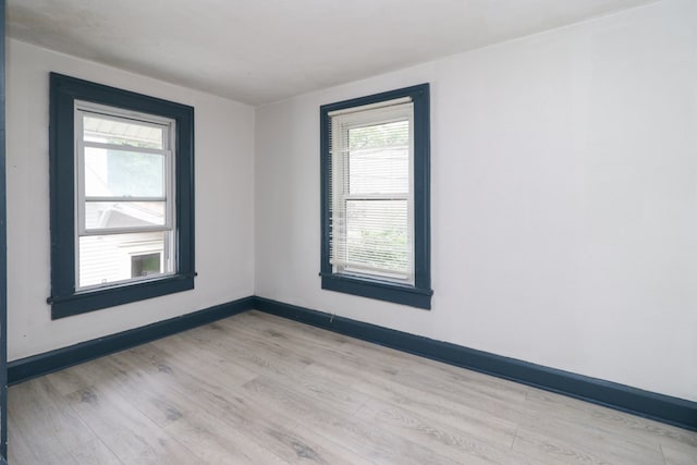 460 W Dickson, Mansfield, OH 44903 - unfurnished room with light wood finished floors and healthy amount of natural light