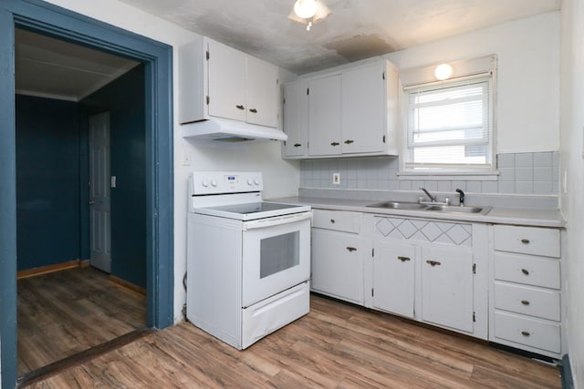 460 W Dickson, Mansfield, OH 44903 - kitchen with electric stove, under cabinet range hood, white cabinets, and light countertops