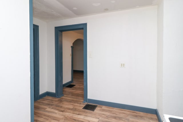 460 W Dickson, Mansfield, OH 44903 - unfurnished room with arched walkways and wood finished floors