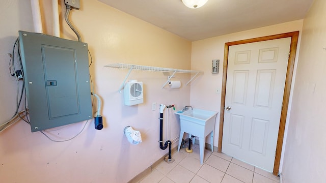 washroom featuring electric panel and light tile patterned floors