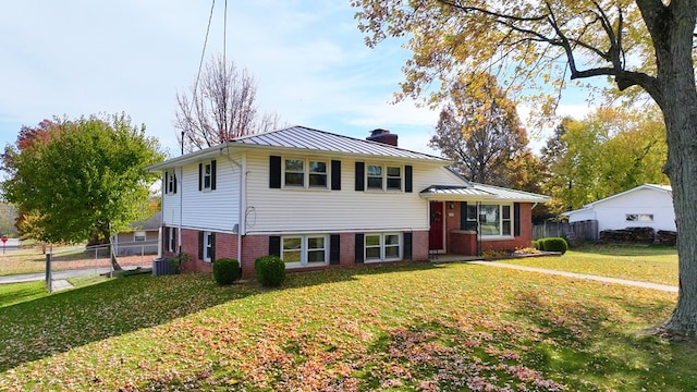 split level home featuring a front lawn