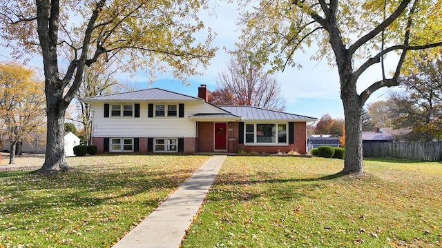 tri-level home with a front yard