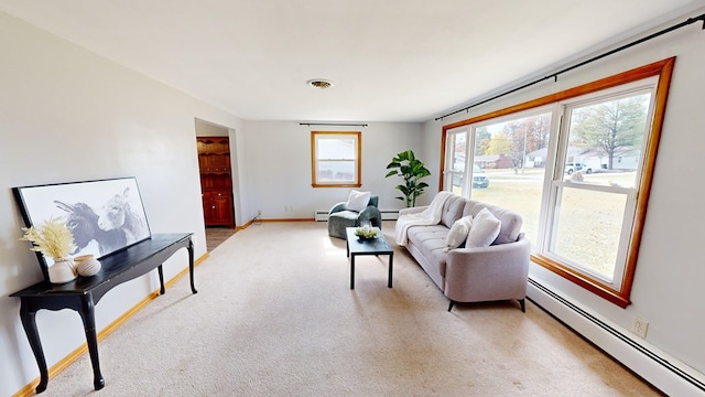 living room featuring baseboard heating and light carpet