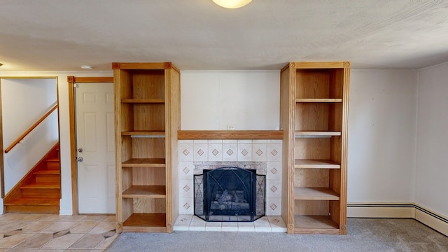 unfurnished living room with a tiled fireplace