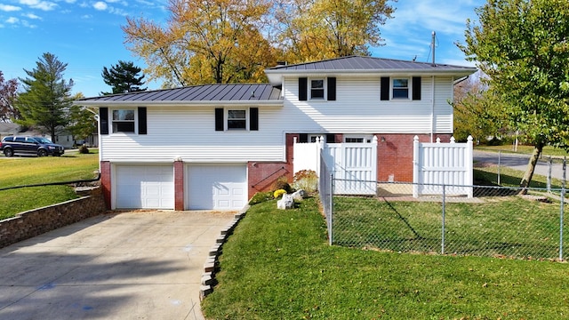 view of front of property with a garage and a front lawn