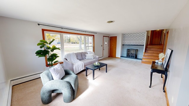 carpeted living room with a tile fireplace and a baseboard radiator