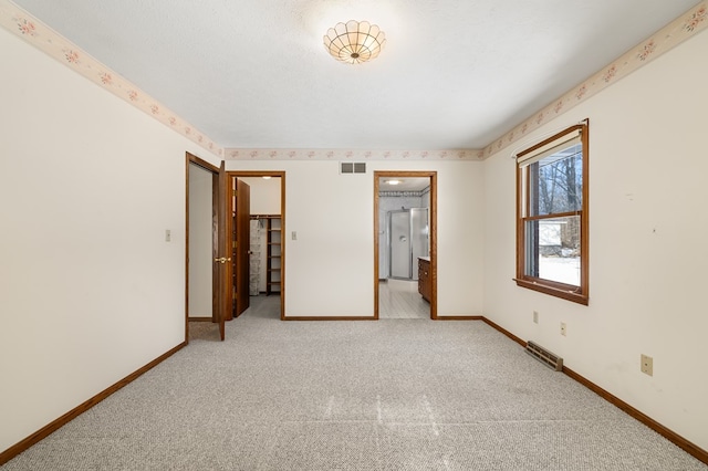 unfurnished bedroom featuring carpet floors