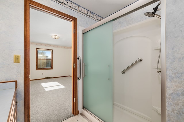 bathroom featuring an enclosed shower