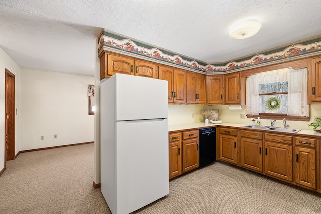 kitchen featuring white refrigerator, dishwasher, sink, and light carpet