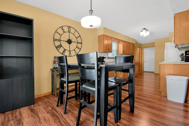 kitchen featuring dark hardwood / wood-style flooring and white refrigerator