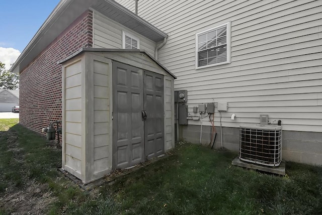 view of outbuilding featuring central AC