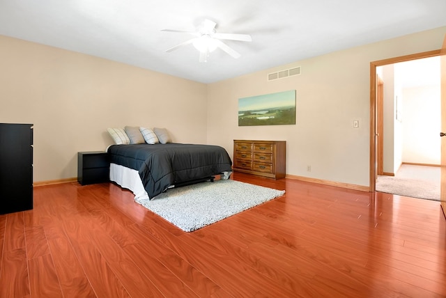 bedroom featuring ceiling fan and hardwood / wood-style flooring