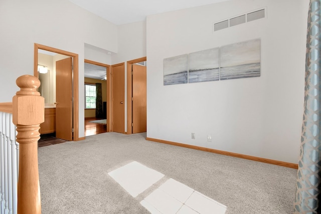 interior space with ceiling fan