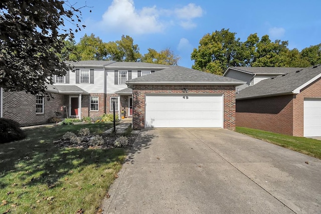 view of front of home featuring a garage and a front lawn