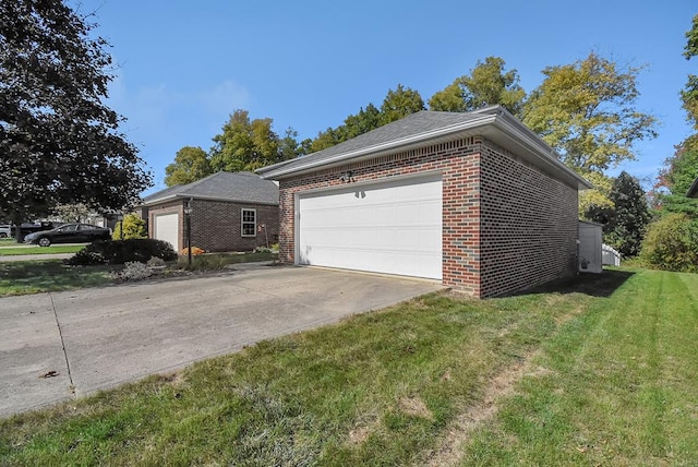 view of home's exterior featuring a yard and a garage