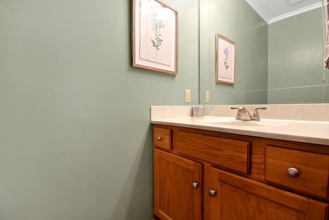 bathroom featuring crown molding and vanity