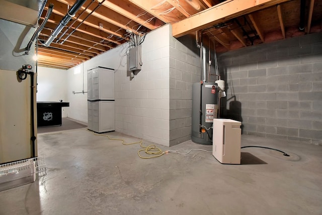 basement featuring white fridge and water heater