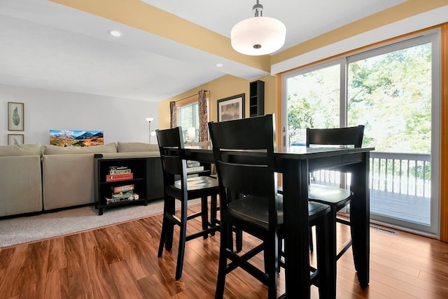 dining room featuring hardwood / wood-style floors and a healthy amount of sunlight