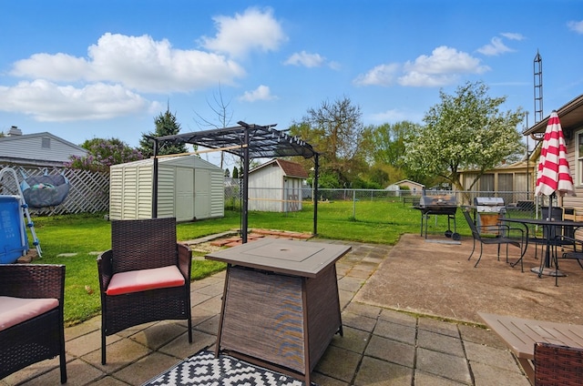 view of patio with a storage unit, a fenced backyard, outdoor dining space, and an outdoor structure