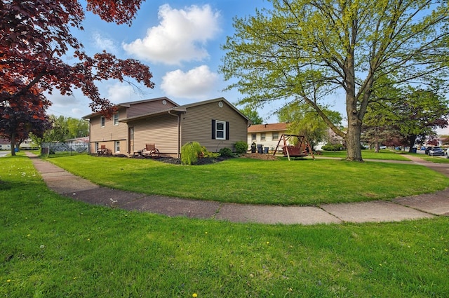 view of side of property featuring a lawn