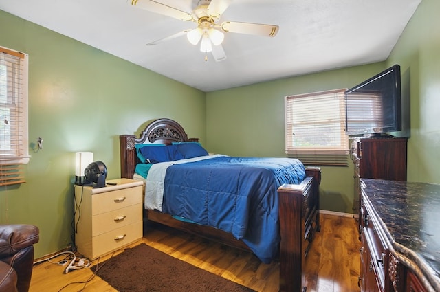 bedroom featuring a ceiling fan and wood finished floors