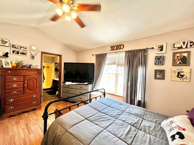 352 Valleybrook Cir, Howard, OH 43028 - bedroom featuring light wood finished floors, lofted ceiling, and ceiling fan