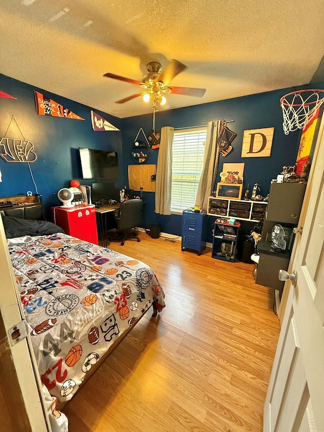 352 Valleybrook Cir, Howard, OH 43028 - bedroom featuring a textured ceiling, wood finished floors, and ceiling fan