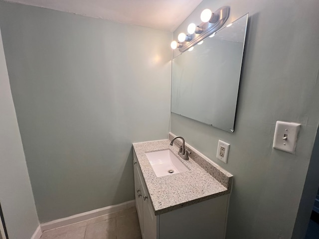 bathroom with tile patterned flooring and vanity