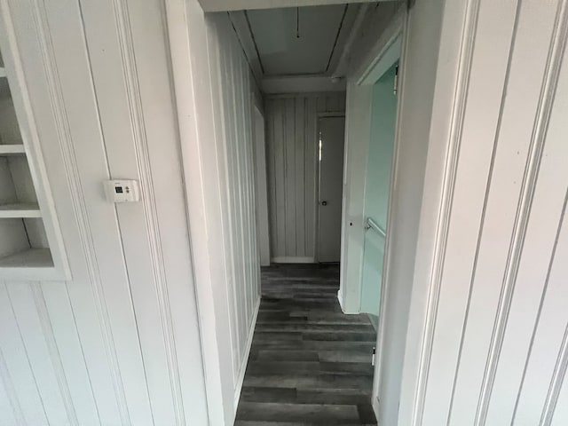 hallway with dark hardwood / wood-style flooring