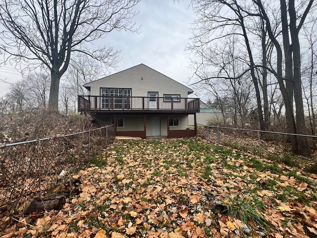 rear view of house featuring a deck