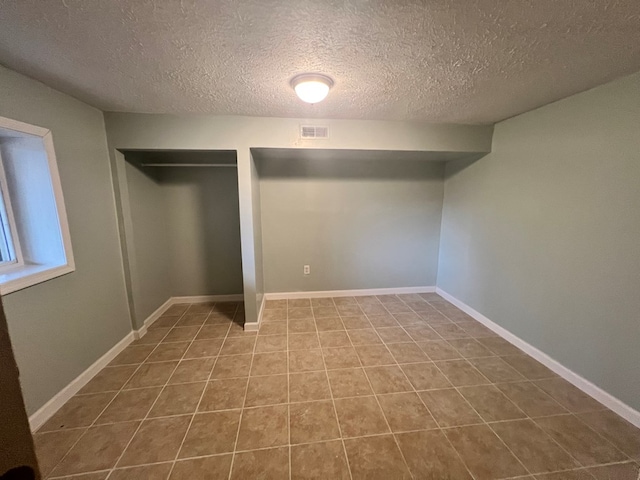 interior space featuring a textured ceiling