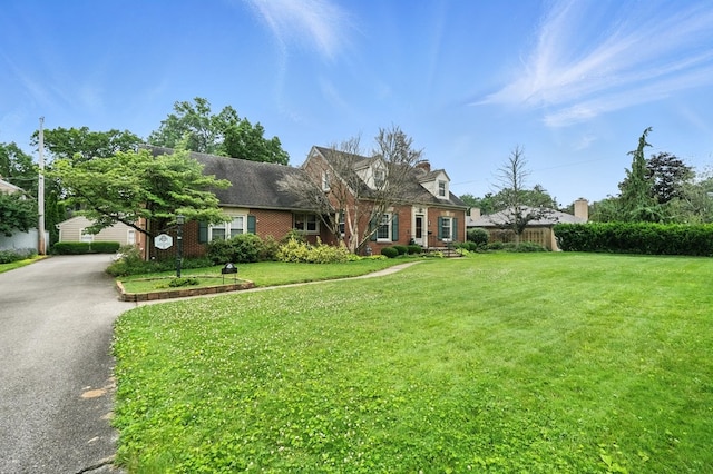 501 Overlook Rd, Mansfield, OH 44907 - cape cod home with a front yard and brick siding