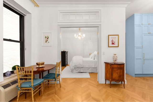 bedroom with ornamental molding, light parquet flooring, multiple windows, and an inviting chandelier