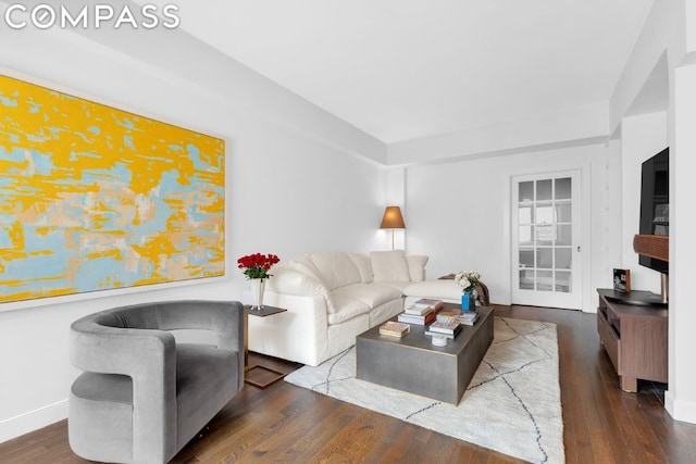 living room with dark hardwood / wood-style floors