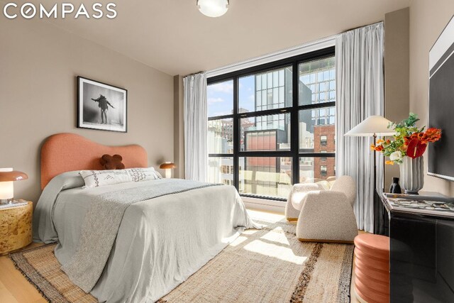 bedroom with hardwood / wood-style flooring