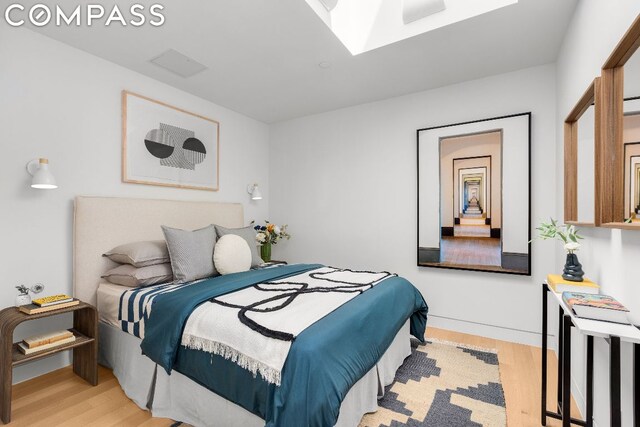 bedroom with light wood-type flooring