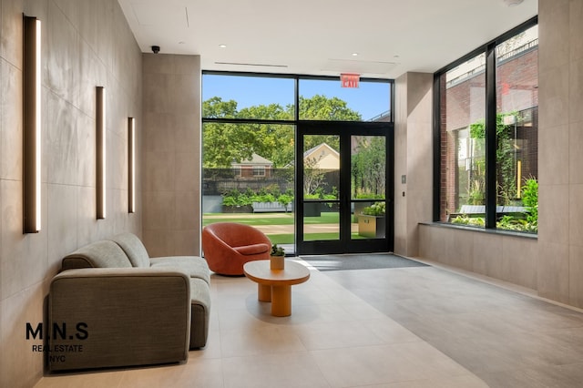 doorway to outside featuring expansive windows