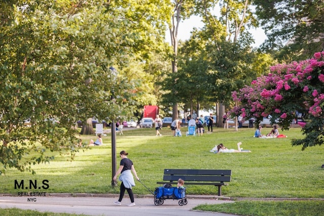 view of home's community featuring a lawn