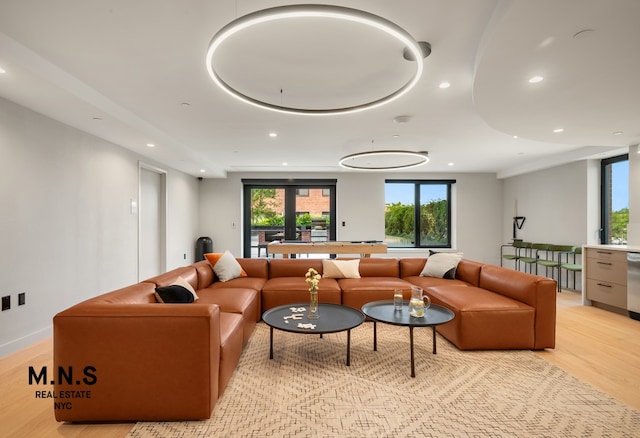 living room featuring recessed lighting and light wood-style flooring